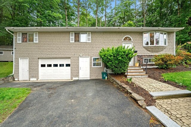 44 Drexel St, Worcester, MA 01602 - raised ranch with driveway and an attached garage