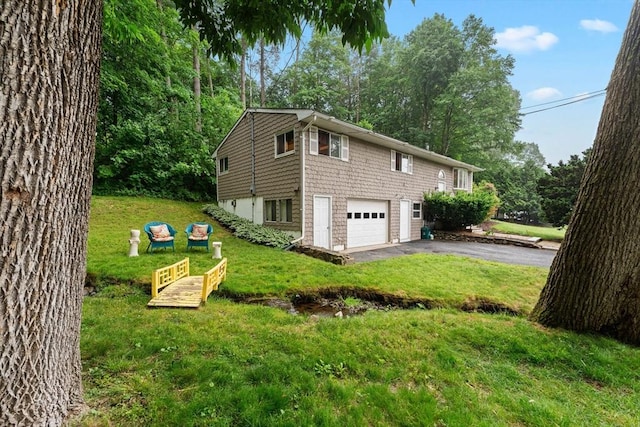 44 Drexel St, Worcester, MA 01602 - view of home's exterior with a garage, asphalt driveway, and a lawn
