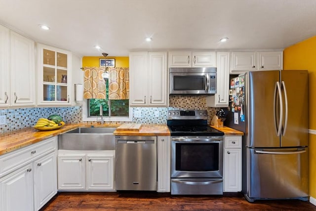 44 Drexel St, Worcester, MA 01602 - kitchen featuring stainless steel appliances, butcher block countertops, a sink, white cabinetry, and dark wood-style flooring