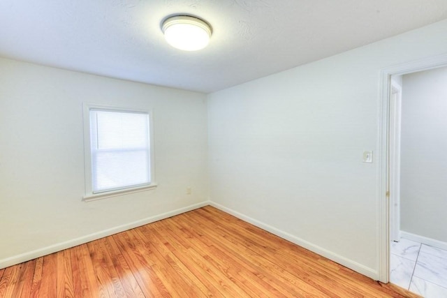 unfurnished room featuring light wood-type flooring