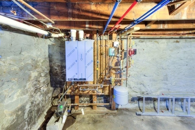 utility room featuring water heater