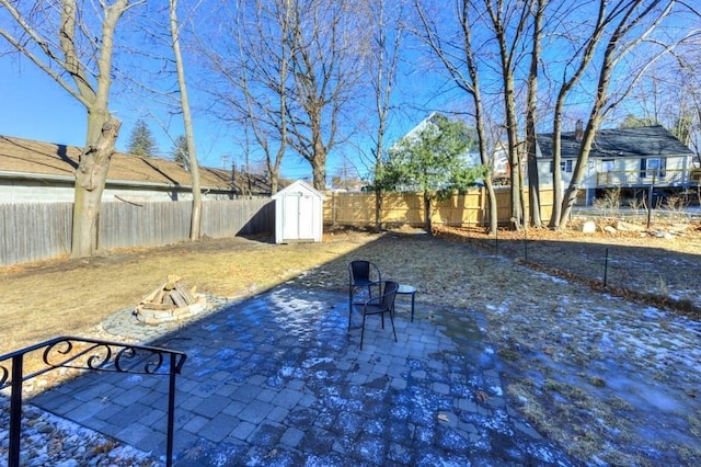 view of yard with a storage shed and a patio area