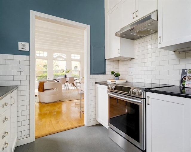 65 Glen Rd Unit H4, Brookline, MA 02445 - kitchen with electric stove, under cabinet range hood, and dark countertops