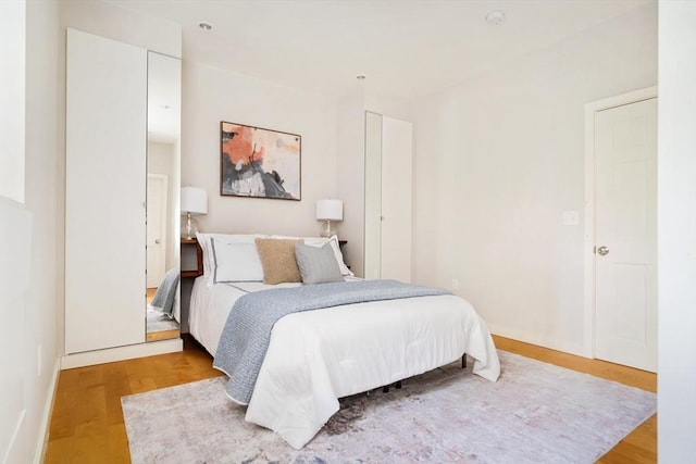 65 Glen Rd Unit H4, Brookline, MA 02445 - bedroom with wood finished floors and baseboards