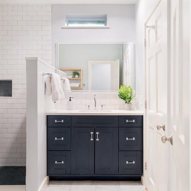 65 Glen Rd Unit H4, Brookline, MA 02445 - full bath with a walk in shower, vanity, decorative backsplash, and tile patterned floors