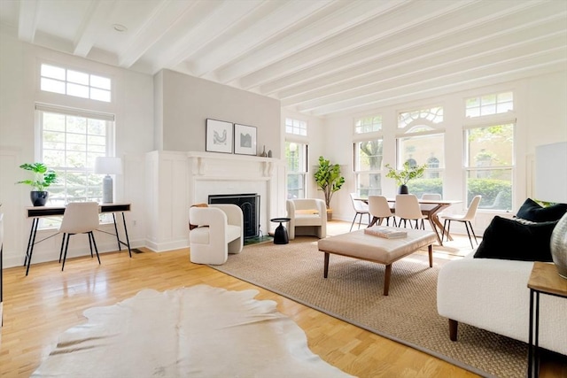 65 Glen Rd Unit H4, Brookline, MA 02445 - living room with beamed ceiling, a fireplace with flush hearth, and wood finished floors