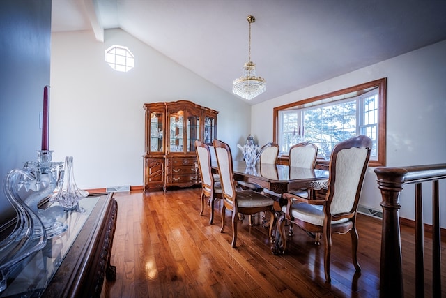 dining room with wood-type flooring, vaulted ceiling with beams, and a notable chandelier