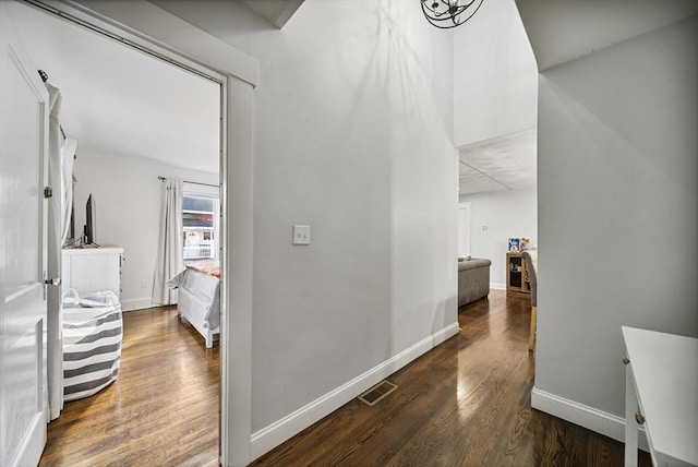 hallway featuring dark hardwood / wood-style flooring