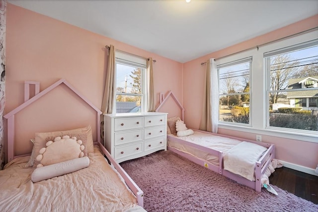 bedroom featuring wood-type flooring