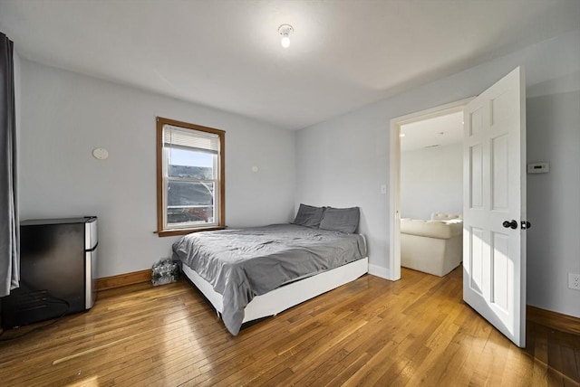 bedroom with light hardwood / wood-style flooring