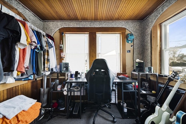 interior space with wooden ceiling and ornamental molding