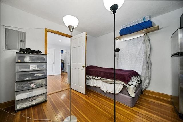 bedroom with wood-type flooring