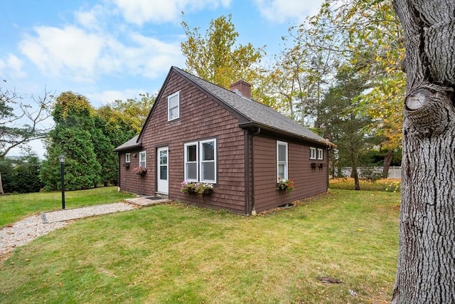 view of property exterior with a yard