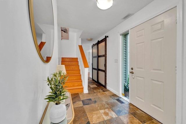 10 Fox Holw Unit 10, Wayland, MA 01778 - foyer entrance with stone finish floors, stairway, and a barn door