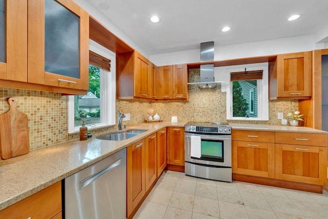 10 Fox Holw Unit 10, Wayland, MA 01778 - kitchen featuring appliances with stainless steel finishes, light stone countertops, brown cabinets, and recessed lighting