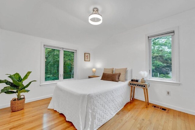 10 Fox Holw Unit 10, Wayland, MA 01778 - bedroom featuring light wood-type flooring and lofted ceiling
