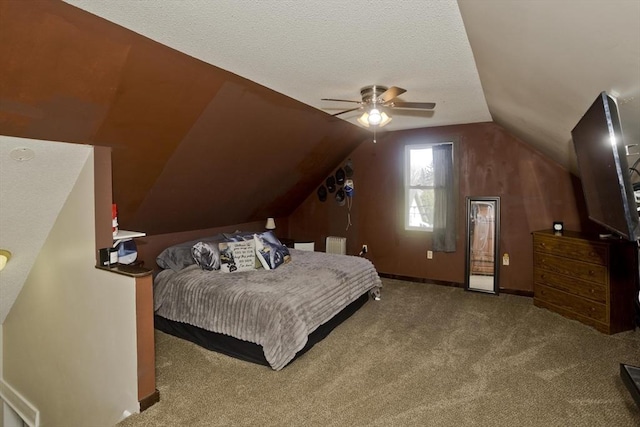 carpeted bedroom with a ceiling fan, baseboards, vaulted ceiling, and a textured ceiling