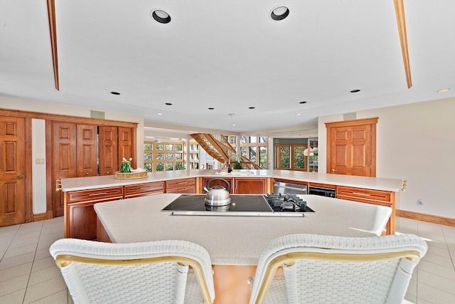 tiled dining area featuring sink