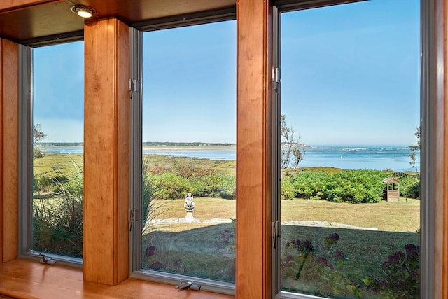 doorway to outside featuring a water view and hardwood / wood-style flooring