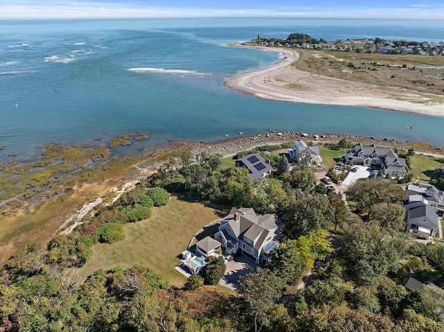 drone / aerial view featuring a water view and a view of the beach