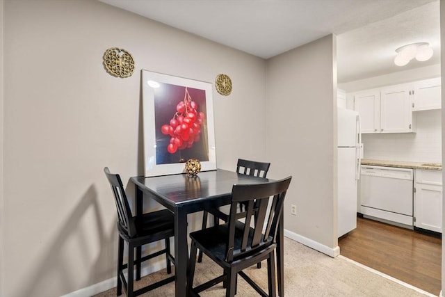 view of carpeted dining area