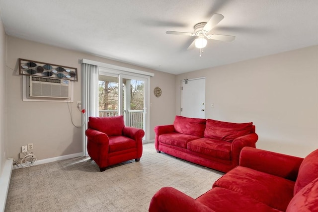 living room featuring light carpet, ceiling fan, and a wall unit AC