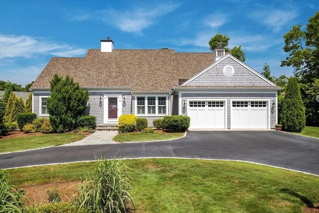 101 Pheasant Hill Cir, Barnstable, MA 02635 - view of front of house with asphalt driveway, a garage, a front yard, and a chimney