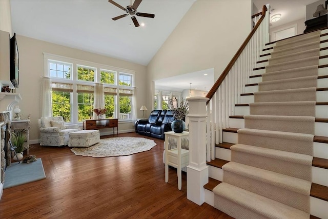 101 Pheasant Hill Cir, Barnstable, MA 02635 - living room with stairway, high vaulted ceiling, ceiling fan, healthy amount of natural light, and wood finished floors