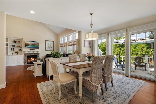 101 Pheasant Hill Cir, Barnstable, MA 02635 - dining space featuring vaulted ceiling, a fireplace with flush hearth, dark wood-style flooring, and recessed lighting