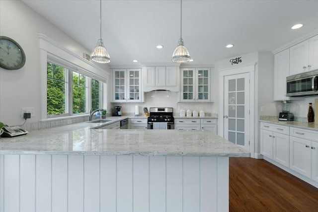 101 Pheasant Hill Cir, Barnstable, MA 02635 - kitchen featuring stainless steel appliances, glass insert cabinets, recessed lighting, white cabinetry, and a chandelier