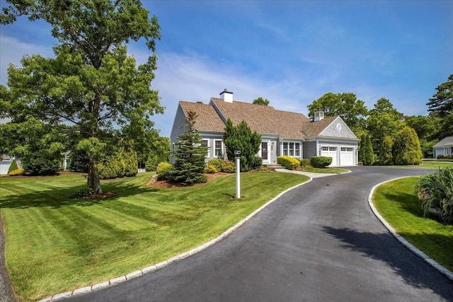 101 Pheasant Hill Cir, Barnstable, MA 02635 - view of front of property featuring a garage, asphalt driveway, a front lawn, and a chimney