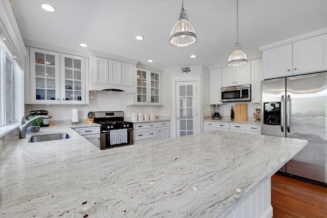 101 Pheasant Hill Cir, Barnstable, MA 02635 - kitchen featuring appliances with stainless steel finishes, a chandelier, light stone countertops, recessed lighting, and hanging light fixtures