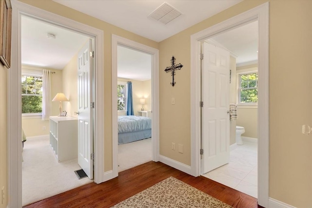 101 Pheasant Hill Cir, Barnstable, MA 02635 - hallway featuring wood finished floors and healthy amount of natural light