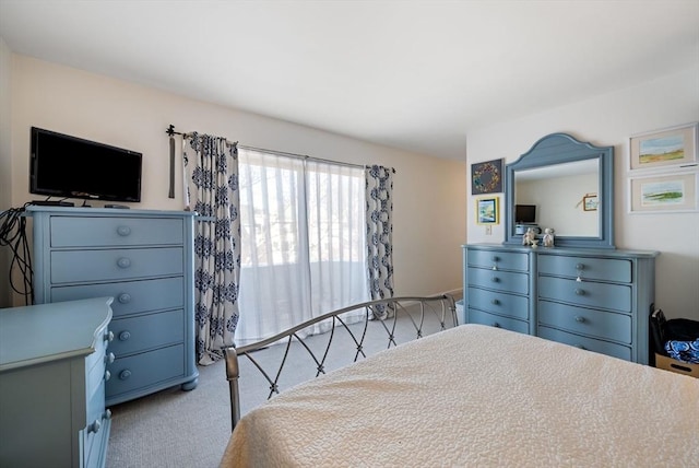 bedroom with light carpet