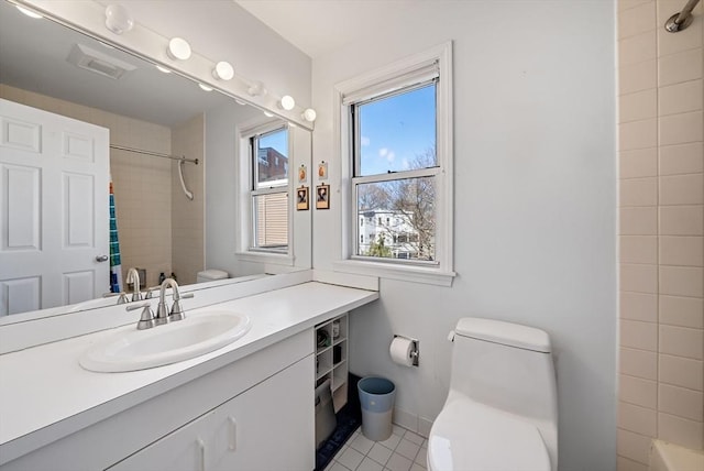 full bath with toilet, vanity, tile patterned flooring, baseboards, and shower / bathtub combination