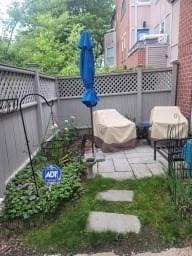 view of patio / terrace featuring fence