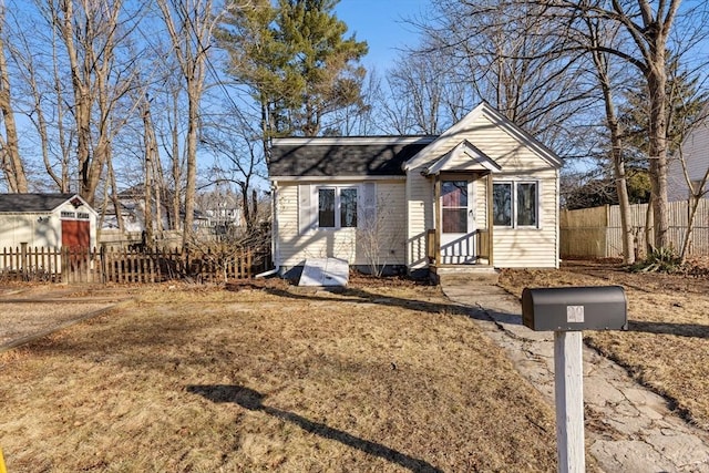 view of front of property featuring fence