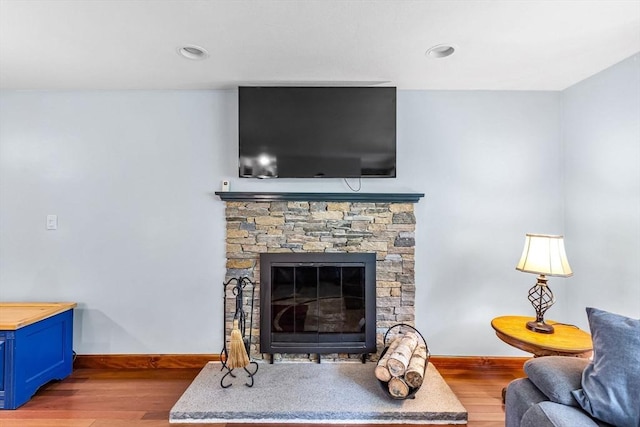 98 Town Farm Rd, Monson, MA 01057 - living area with wood finished floors, baseboards, and a stone fireplace