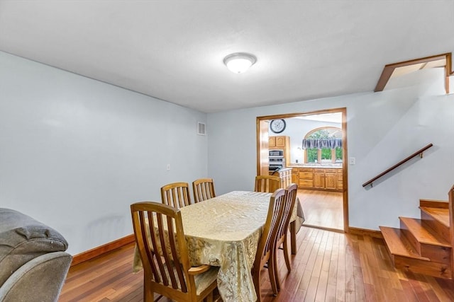 98 Town Farm Rd, Monson, MA 01057 - dining room with wood-type flooring, stairway, and baseboards