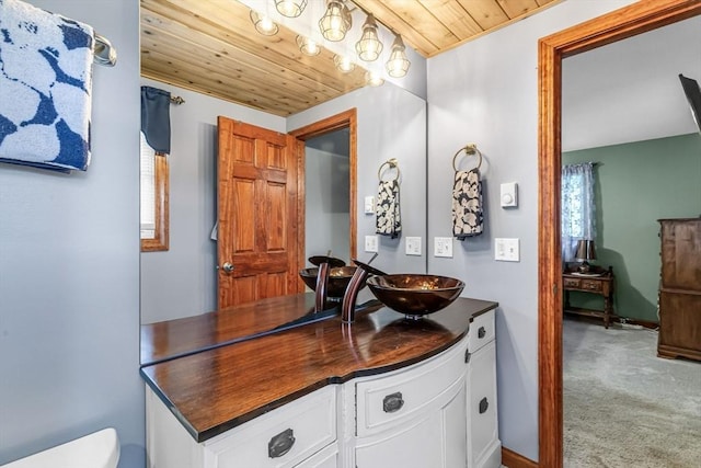 98 Town Farm Rd, Monson, MA 01057 - bathroom featuring wood ceiling, vanity, toilet, and baseboards