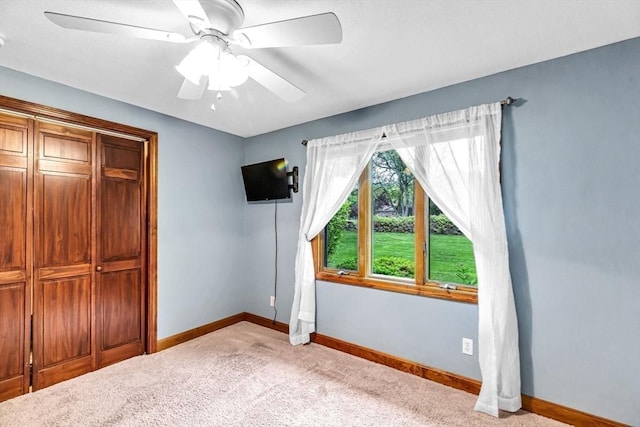 98 Town Farm Rd, Monson, MA 01057 - unfurnished bedroom with baseboards, light colored carpet, a ceiling fan, and a closet