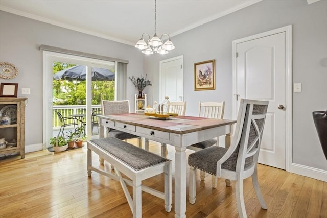 5 Mackenzie Way Unit 5, Haverhill, MA 01832 - dining space with a chandelier, crown molding, and light wood-style flooring