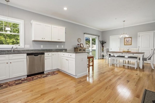 5 Mackenzie Way Unit 5, Haverhill, MA 01832 - kitchen with stainless steel dishwasher, light wood-type flooring, white cabinetry, a peninsula, and crown molding