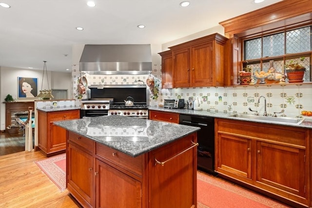 kitchen with wall chimney exhaust hood, backsplash, dark stone counters, light hardwood / wood-style floors, and a kitchen island