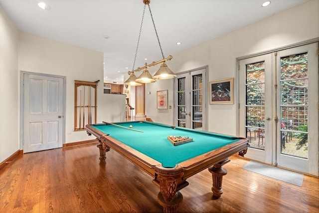 rec room with french doors, hardwood / wood-style floors, and pool table