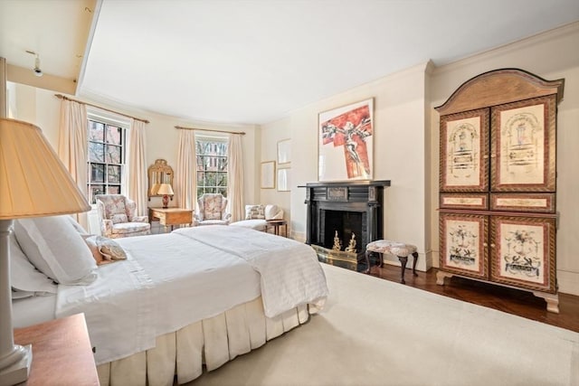 bedroom featuring hardwood / wood-style flooring and ornamental molding