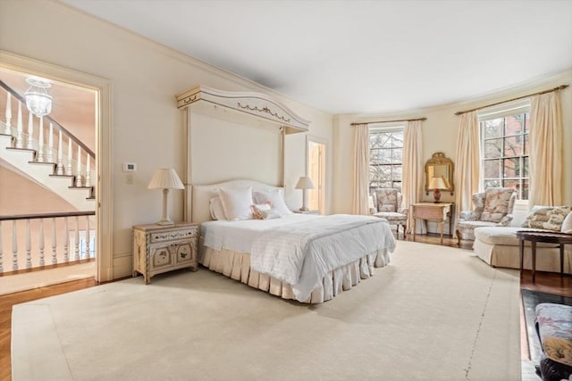 bedroom featuring crown molding