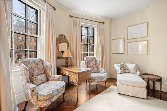 living area featuring parquet floors and crown molding