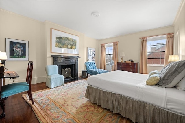 bedroom with wood-type flooring, multiple windows, and ornamental molding