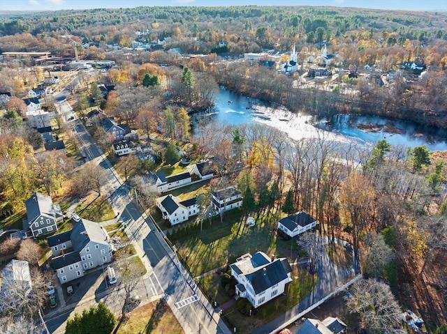 aerial view featuring a water view and a wooded view